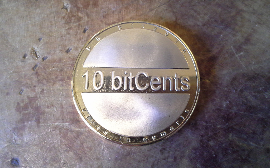 A series one bhCoin 10-bitcent brass piece.