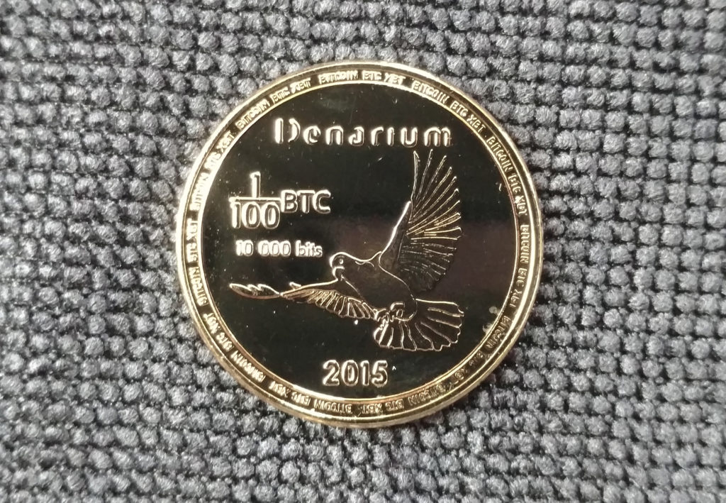 Denarium gold-plated 1/100 BTC piece.