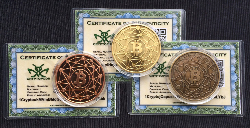 Cryptopods "Ravenbit Podified" coins with laminated certificates of authenticity.